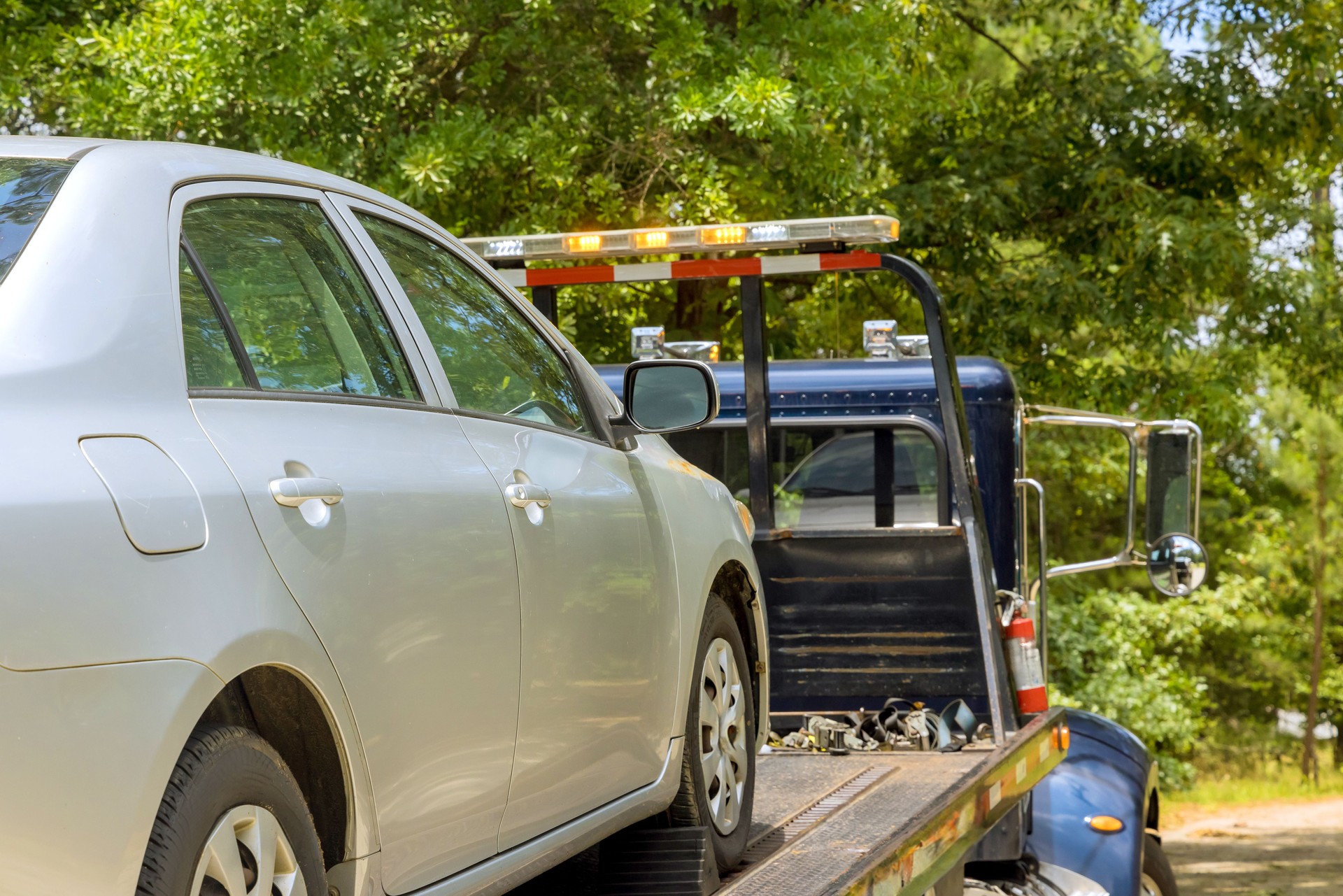 Car service transportation of non working car on a tow truck