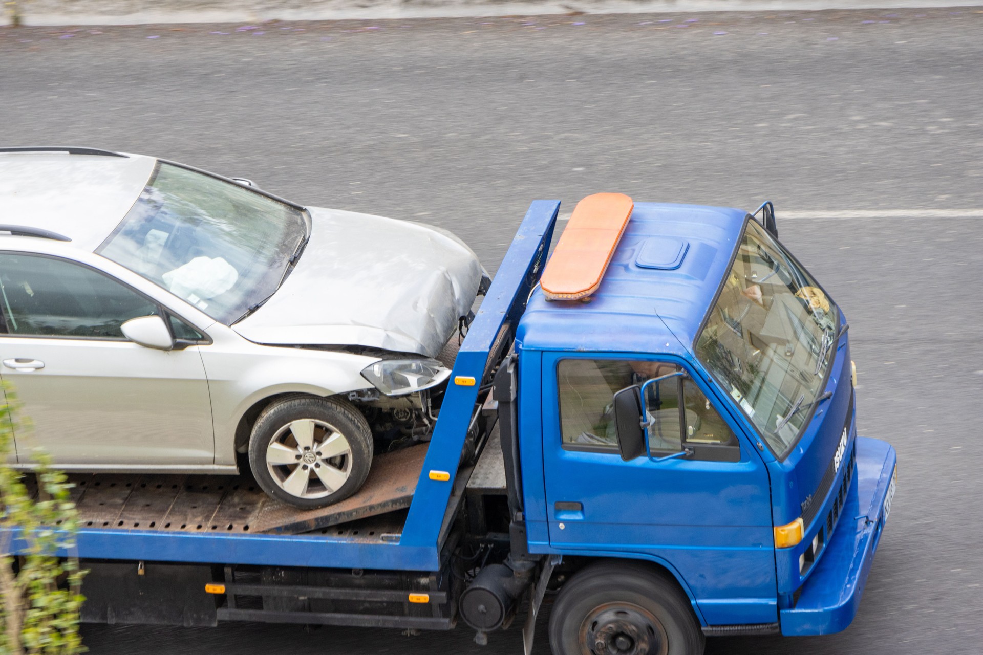 Tow truck removing a damaged car after traffic accident